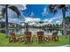 Four chairs overlooking a peaceful lake at 23465 Harborview Rd # 734, Punta Gorda, FL 33980