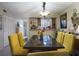 Dining room with yellow chairs and kitchen view at 2625 State Road 590 # 124, Clearwater, FL 33759