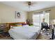Main bedroom with king bed and large window at 2625 State Road 590 # 124, Clearwater, FL 33759