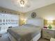 Main bedroom with king bed and white dresser at 2625 State Road 590 # 124, Clearwater, FL 33759