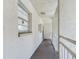 Hallway with access to condo unit and balcony at 2625 State Road 590 # 124, Clearwater, FL 33759