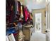 Large walk-in closet with shelving and lots of clothes at 2625 State Road 590 # 124, Clearwater, FL 33759