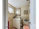 Bathroom featuring vanity, toilet and window at 2625 State Road 590 # 124, Clearwater, FL 33759