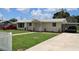 House with driveway and landscaping at 6702 71St N Ave, Pinellas Park, FL 33781