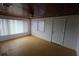 Simple living room with light wood floors and ceiling fan at 6702 71St N Ave, Pinellas Park, FL 33781