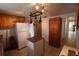 Bright kitchen with wood cabinets, island, and pot rack at 6702 71St N Ave, Pinellas Park, FL 33781