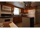 Kitchen with wood cabinets, microwave, stove, and dishwasher at 6702 71St N Ave, Pinellas Park, FL 33781