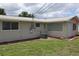 Side of house with A/C unit and landscaping at 6702 71St N Ave, Pinellas Park, FL 33781