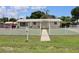 House with white picket fence and walkway at 6702 71St N Ave, Pinellas Park, FL 33781