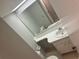 Simple bathroom with a white vanity and a toilet at 24 Quails Run Blvd # 3, Englewood, FL 34223