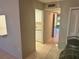 View of dining area and kitchen entry at 24 Quails Run Blvd # 3, Englewood, FL 34223