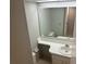 Clean bathroom featuring a vanity and a large mirror at 24 Quails Run Blvd # 3, Englewood, FL 34223