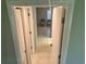 View down hallway showing access to rooms at 24 Quails Run Blvd # 3, Englewood, FL 34223