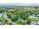 Aerial view of a single-Gathering home on a tree-lined street in a residential neighborhood at 1512 E Shadowlawn Ave, Tampa, FL 33610