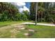 Large grassy area with tropical vegetation at 1422 Bayshore Rd, Ruskin, FL 33570