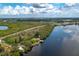 Aerial view of waterfront property with home and private dock access at 1422 Bayshore Rd, Ruskin, FL 33570