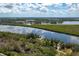 Aerial view of waterfront property with boat dock at 1422 Bayshore Rd, Ruskin, FL 33570