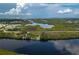 Aerial view showing home on waterfront property with private dock at 1422 Bayshore Rd, Ruskin, FL 33570