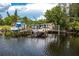 Private boat dock with a boat and waterfront views at 1422 Bayshore Rd, Ruskin, FL 33570