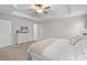 Large main bedroom with king-size bed and dresser at 9681 Flourish Dr, Land O Lakes, FL 34637