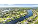 Aerial view showcasing a waterfront property with canal access at 272 E Tarpon Nw Blvd, Port Charlotte, FL 33952