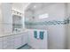 Spa-like bathroom with walk-in shower, double vanity and tile details at 5330 Silver Sun Dr, Apollo Beach, FL 33572