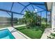 Relaxing screened lanai with lush landscaping and pool views at 5330 Silver Sun Dr, Apollo Beach, FL 33572