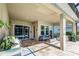 Covered patio with fire pit and outdoor seating at 5330 Silver Sun Dr, Apollo Beach, FL 33572