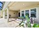 Covered patio with fire pit and outdoor seating at 5330 Silver Sun Dr, Apollo Beach, FL 33572