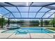 Relaxing pool and spa with a covered lanai and lake view at 5330 Silver Sun Dr, Apollo Beach, FL 33572