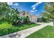 Beautiful two-story home with landscaping and driveway at 5330 Silver Sun Dr, Apollo Beach, FL 33572