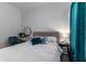 Guest bedroom with a full-size bed and teal decor at 5330 Silver Sun Dr, Apollo Beach, FL 33572