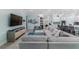 Spacious living room with sectional sofa and large TV at 5330 Silver Sun Dr, Apollo Beach, FL 33572