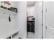 Bright laundry room with washer, dryer and built-in shelving at 5330 Silver Sun Dr, Apollo Beach, FL 33572