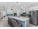 Modern kitchen with white cabinets, quartz countertops, and island at 5330 Silver Sun Dr, Apollo Beach, FL 33572