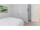 Guest bedroom with double doors to closet and window with blinds at 5330 Silver Sun Dr, Apollo Beach, FL 33572