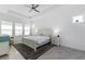Spacious primary bedroom with a king-size bed and plenty of natural light at 5330 Silver Sun Dr, Apollo Beach, FL 33572