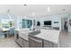 Open concept kitchen with farmhouse sink, stainless steel appliances, and island at 5330 Silver Sun Dr, Apollo Beach, FL 33572