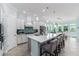 Modern kitchen with white cabinets, quartz countertops and island at 5330 Silver Sun Dr, Apollo Beach, FL 33572