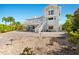 Two-story home with deck and waterfront view at 13065 Via Aurelia, Placida, FL 33946