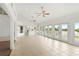Sunroom with kitchen view, tile floor and multiple doors at 13065 Via Aurelia, Placida, FL 33946