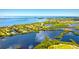 Wide shot of waterfront home and neighborhood at 13065 Via Aurelia, Placida, FL 33946