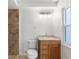 Clean bathroom with a single sink vanity, shower, and toilet at 13065 Via Aurelia, Placida, FL 33946