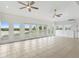 Sunroom with water views and multiple glass doors at 13065 Via Aurelia, Placida, FL 33946