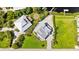 Aerial view of the property with two houses and lush green surroundings at 13065 Via Aurelia, Placida, FL 33946