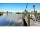 Wooden dock with lift, offering convenient water access at 13065 Via Aurelia, Placida, FL 33946
