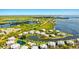 Aerial view of luxurious waterfront community with resort amenities at 13065 Via Aurelia, Placida, FL 33946