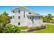 Two-story home with white exterior and landscaping at 13065 Via Aurelia, Placida, FL 33946
