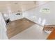 Open living room with vaulted ceiling, hardwood floors, and fireplace at 13065 Via Aurelia, Placida, FL 33946
