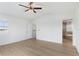 Bright bedroom with wood-look floors and access to en-suite bathroom at 13065 Via Aurelia, Placida, FL 33946